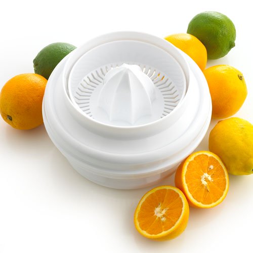 Manual Citrus juicer surrounded by Oranges.