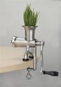 Photo of a stainless steel wheatgrass juicer.